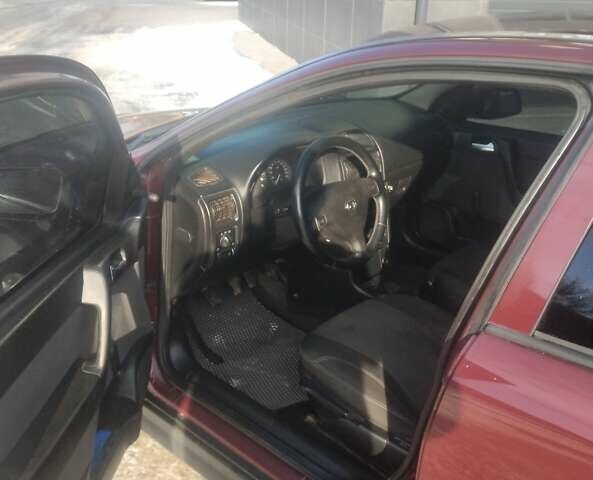 Красный Опель Астра, объемом двигателя 1.4 л и пробегом 240 тыс. км за 3599 $, фото 1 на Automoto.ua