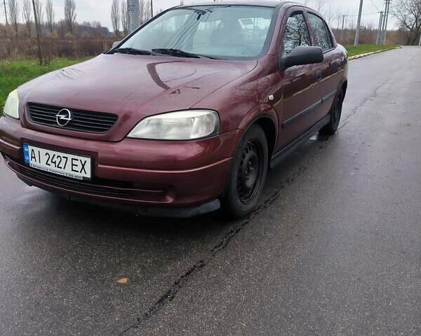Красный Опель Астра, объемом двигателя 1.36 л и пробегом 327 тыс. км за 2900 $, фото 1 на Automoto.ua