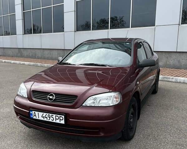 Червоний Опель Астра, об'ємом двигуна 1.36 л та пробігом 68 тис. км за 5400 $, фото 1 на Automoto.ua
