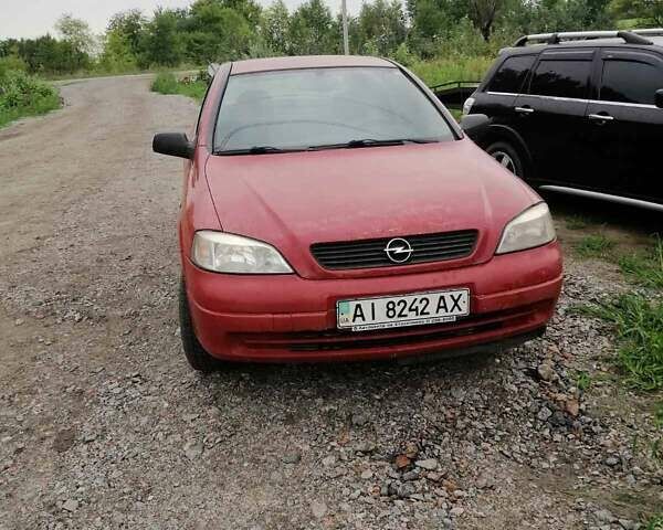 Красный Опель Астра, объемом двигателя 1.6 л и пробегом 150 тыс. км за 4000 $, фото 1 на Automoto.ua