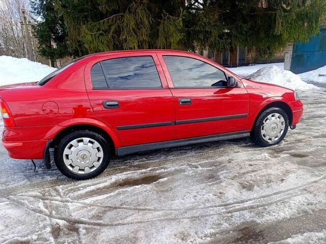 Красный Опель Астра, объемом двигателя 1.4 л и пробегом 199 тыс. км за 1520 $, фото 1 на Automoto.ua