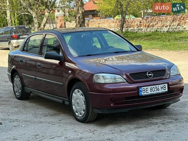 Красный Опель Астра, объемом двигателя 1.6 л и пробегом 248 тыс. км за 3600 $, фото 1 на Automoto.ua