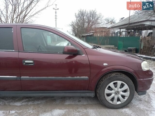 Красный Опель Астра, объемом двигателя 1.4 л и пробегом 170 тыс. км за 4300 $, фото 1 на Automoto.ua