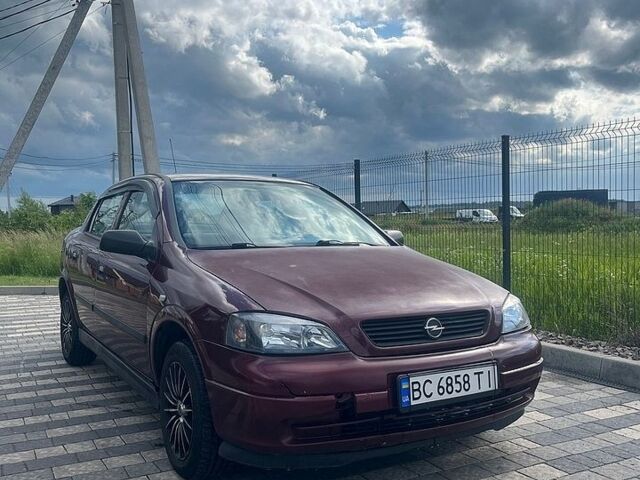 Красный Опель Астра, объемом двигателя 1.36 л и пробегом 245 тыс. км за 3100 $, фото 1 на Automoto.ua