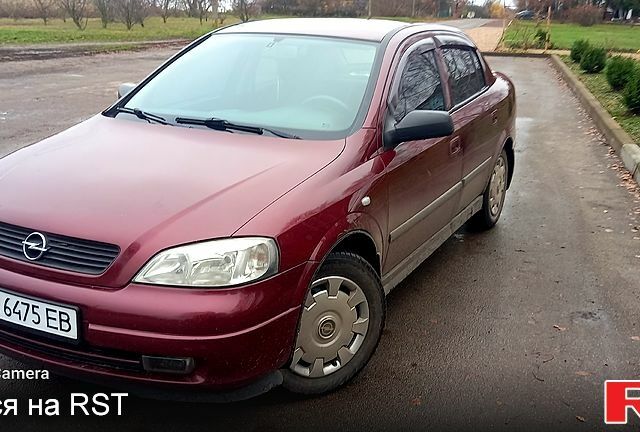 Красный Опель Астра, объемом двигателя 1.4 л и пробегом 100 тыс. км за 3100 $, фото 1 на Automoto.ua