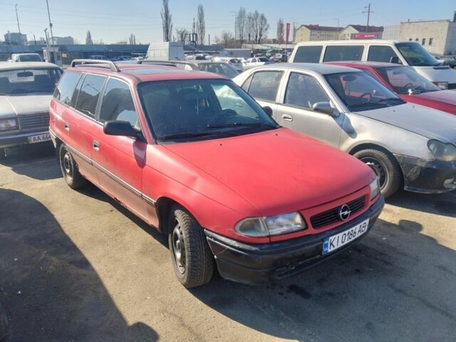 Красный Опель Астра, объемом двигателя 1.4 л и пробегом 215 тыс. км за 900 $, фото 1 на Automoto.ua