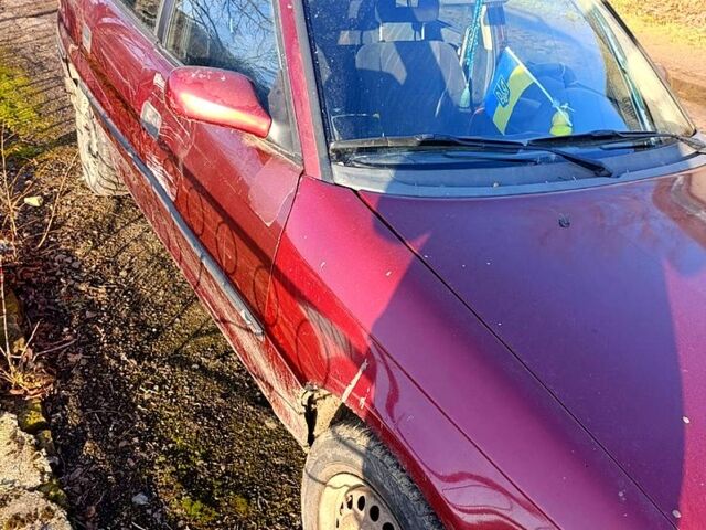 Красный Опель Астра, объемом двигателя 1.6 л и пробегом 256 тыс. км за 1000 $, фото 1 на Automoto.ua