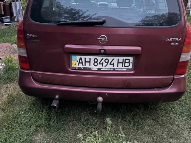 Красный Опель Астра, объемом двигателя 1.6 л и пробегом 560 тыс. км за 1900 $, фото 1 на Automoto.ua