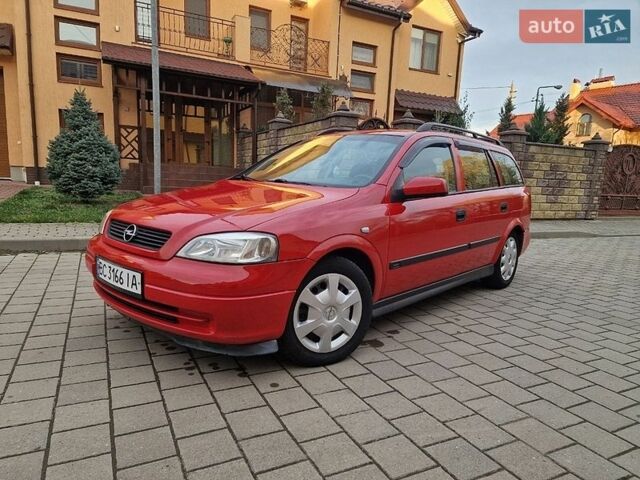 Красный Опель Астра, объемом двигателя 1.6 л и пробегом 239 тыс. км за 2350 $, фото 1 на Automoto.ua