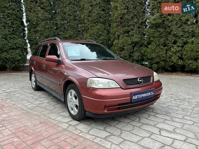Красный Опель Астра, объемом двигателя 1.6 л и пробегом 266 тыс. км за 4000 $, фото 1 на Automoto.ua