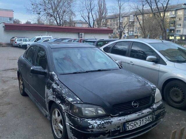 Серый Опель Астра, объемом двигателя 2 л и пробегом 300 тыс. км за 900 $, фото 1 на Automoto.ua