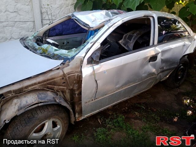 Серый Опель Астра, объемом двигателя 2 л и пробегом 357 тыс. км за 500 $, фото 1 на Automoto.ua