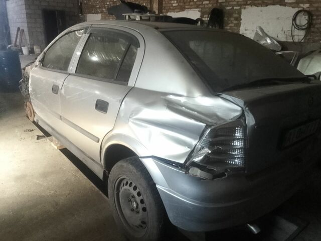 Серый Опель Астра, объемом двигателя 2 л и пробегом 230 тыс. км за 1000 $, фото 1 на Automoto.ua