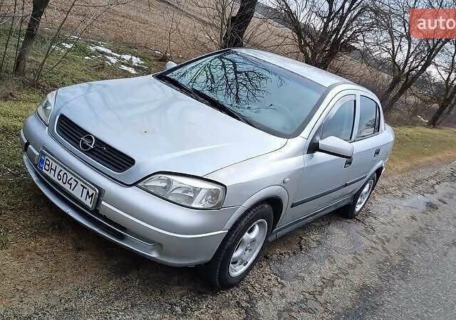 Серый Опель Астра, объемом двигателя 1.4 л и пробегом 290 тыс. км за 1000 $, фото 1 на Automoto.ua