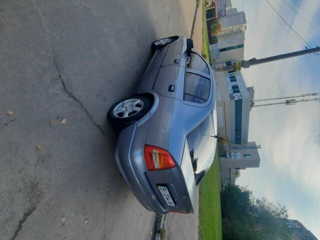 Серый Опель Астра, объемом двигателя 1.4 л и пробегом 282 тыс. км за 3700 $, фото 1 на Automoto.ua