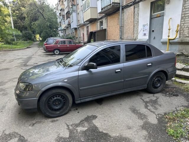 Серый Опель Астра, объемом двигателя 1.4 л и пробегом 210 тыс. км за 3402 $, фото 1 на Automoto.ua