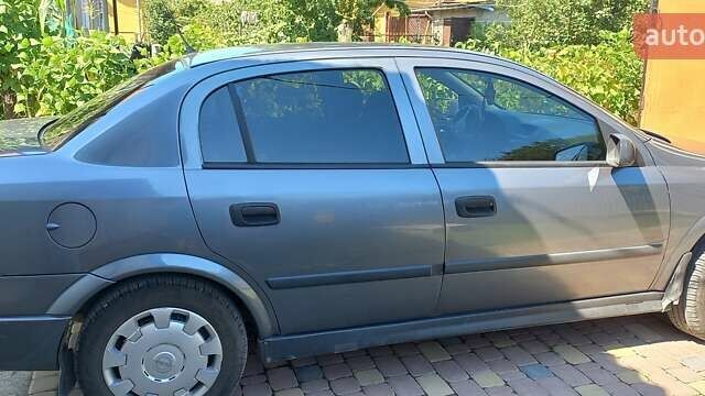 Серый Опель Астра, объемом двигателя 1.4 л и пробегом 169 тыс. км за 4400 $, фото 1 на Automoto.ua