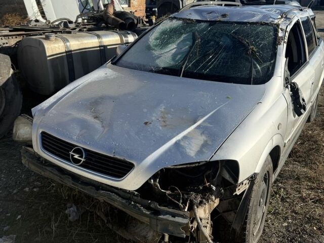 Серый Опель Астра, объемом двигателя 1.7 л и пробегом 300 тыс. км за 592 $, фото 1 на Automoto.ua