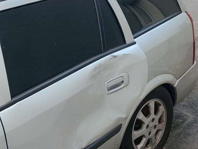 Серый Опель Астра, объемом двигателя 0 л и пробегом 150 тыс. км за 1100 $, фото 1 на Automoto.ua