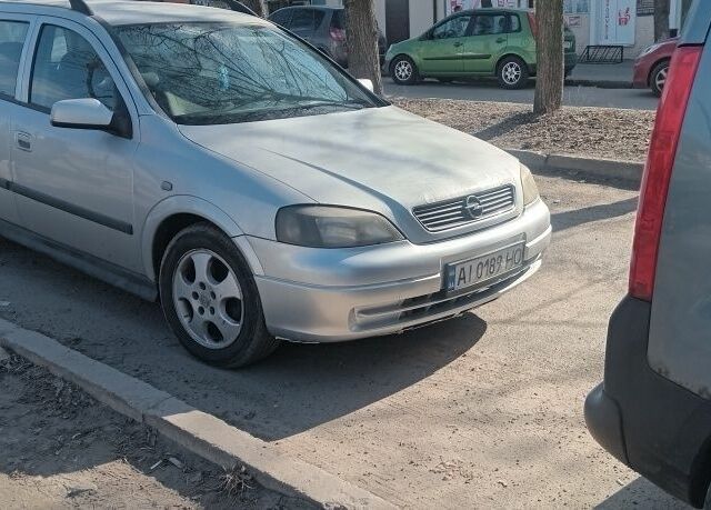Серый Опель Астра, объемом двигателя 2 л и пробегом 400 тыс. км за 1700 $, фото 1 на Automoto.ua