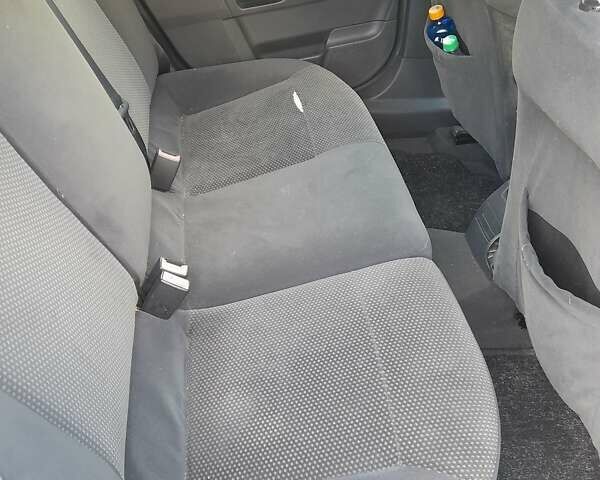 Серый Опель Астра, объемом двигателя 1 л и пробегом 300 тыс. км за 4400 $, фото 1 на Automoto.ua