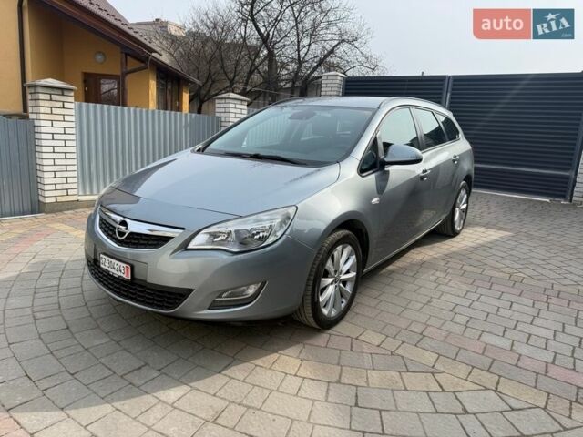 Серый Опель Астра, объемом двигателя 1.4 л и пробегом 153 тыс. км за 7499 $, фото 1 на Automoto.ua