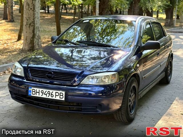 Синий Опель Астра, объемом двигателя 2 л и пробегом 148 тыс. км за 2550 $, фото 1 на Automoto.ua