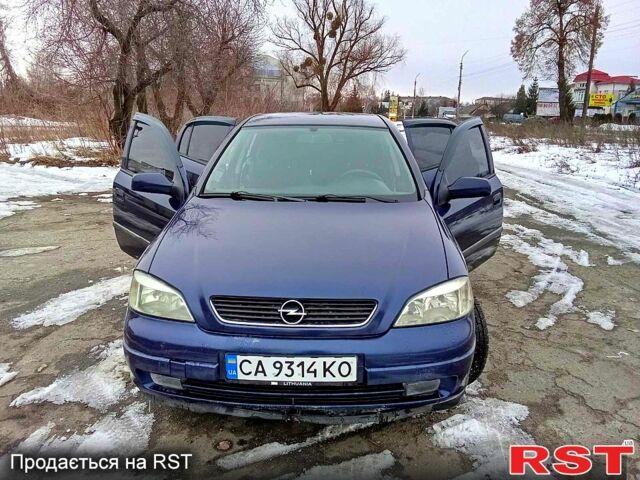Синий Опель Астра, объемом двигателя 2 л и пробегом 220 тыс. км за 3250 $, фото 1 на Automoto.ua