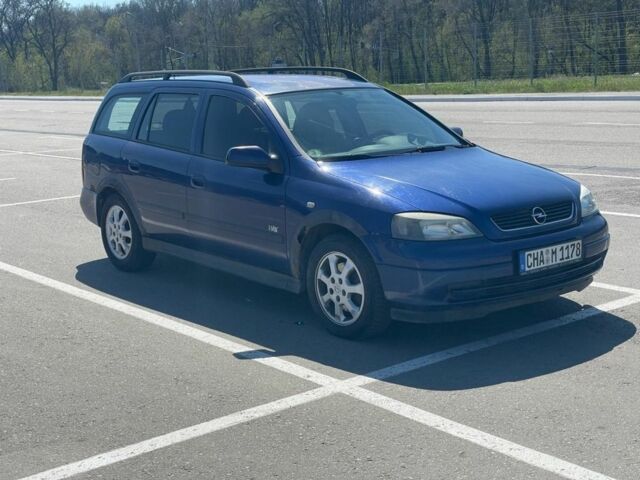 Синій Опель Астра, об'ємом двигуна 2 л та пробігом 320 тис. км за 1200 $, фото 1 на Automoto.ua