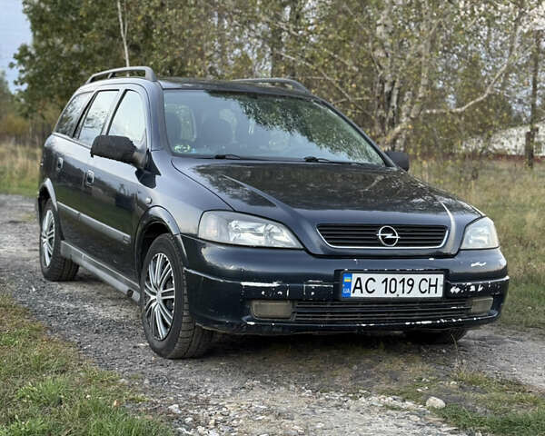 Синий Опель Астра, объемом двигателя 2 л и пробегом 250 тыс. км за 2350 $, фото 1 на Automoto.ua