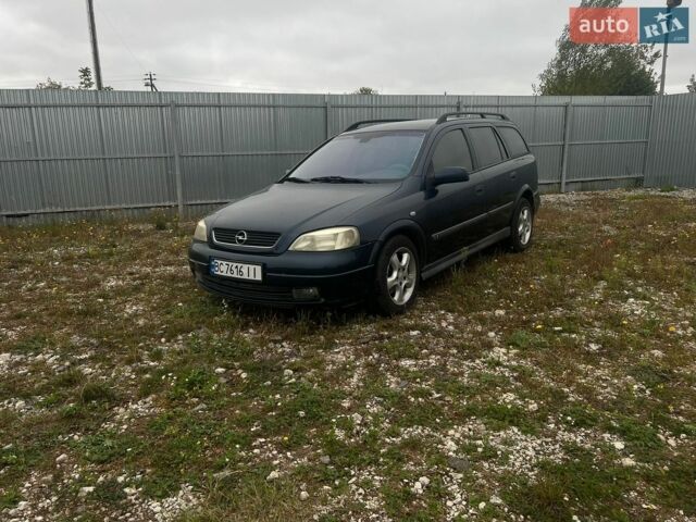 Синій Опель Астра, об'ємом двигуна 2 л та пробігом 300 тис. км за 1900 $, фото 1 на Automoto.ua
