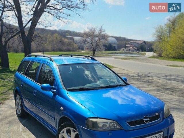 Синий Опель Астра, объемом двигателя 2 л и пробегом 250 тыс. км за 3950 $, фото 1 на Automoto.ua