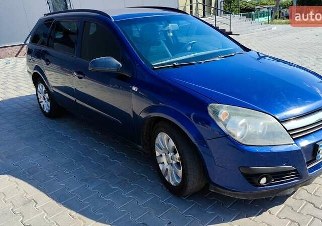 Синий Опель Астра, объемом двигателя 1.2 л и пробегом 328 тыс. км за 4600 $, фото 1 на Automoto.ua