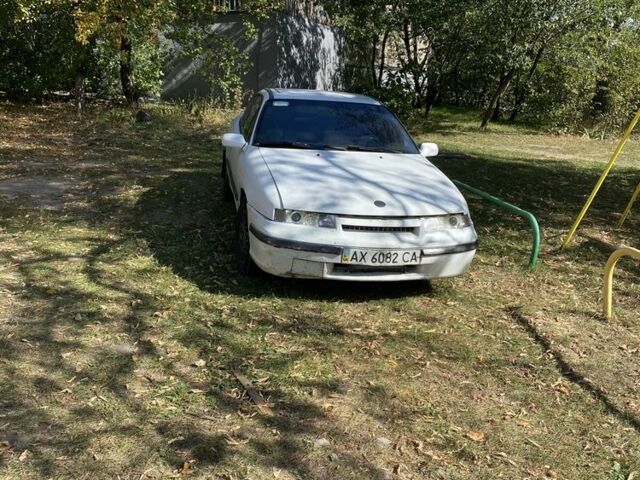 Белый Опель Калибра, объемом двигателя 2 л и пробегом 250 тыс. км за 1500 $, фото 1 на Automoto.ua