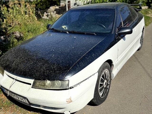 Білий Опель Калібра, об'ємом двигуна 2 л та пробігом 470 тис. км за 2700 $, фото 1 на Automoto.ua