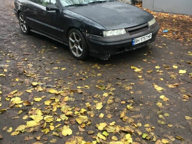 Черный Опель Калибра, объемом двигателя 2 л и пробегом 300 тыс. км за 1700 $, фото 1 на Automoto.ua