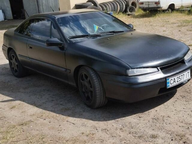 Чорний Опель Калібра, об'ємом двигуна 2.5 л та пробігом 300 тис. км за 3300 $, фото 1 на Automoto.ua