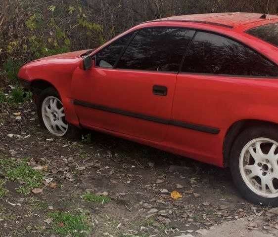 Красный Опель Калибра, объемом двигателя 2 л и пробегом 497 тыс. км за 1200 $, фото 1 на Automoto.ua