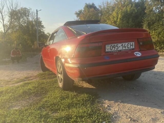 Красный Опель Калибра, объемом двигателя 2 л и пробегом 270 тыс. км за 1700 $, фото 1 на Automoto.ua