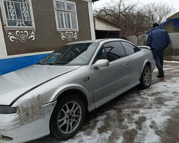 Серый Опель Калибра, объемом двигателя 2.5 л и пробегом 250 тыс. км за 2550 $, фото 1 на Automoto.ua