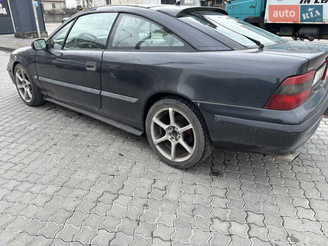 Серый Опель Калибра, объемом двигателя 2 л и пробегом 170 тыс. км за 1800 $, фото 1 на Automoto.ua