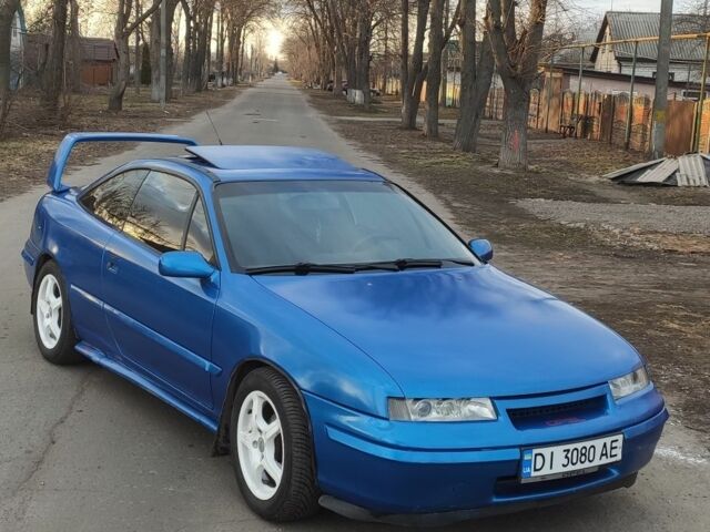 Синій Опель Калібра, об'ємом двигуна 2 л та пробігом 260 тис. км за 2700 $, фото 1 на Automoto.ua