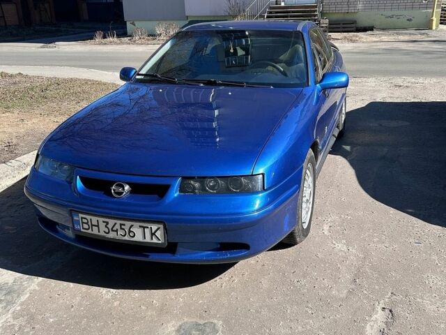Синій Опель Калібра, об'ємом двигуна 2 л та пробігом 250 тис. км за 4200 $, фото 1 на Automoto.ua