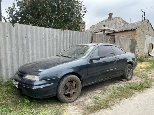 Синий Опель Калибра, объемом двигателя 3 л и пробегом 125 тыс. км за 651 $, фото 1 на Automoto.ua