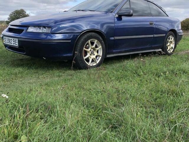 Синий Опель Калибра, объемом двигателя 2 л и пробегом 300 тыс. км за 3000 $, фото 1 на Automoto.ua