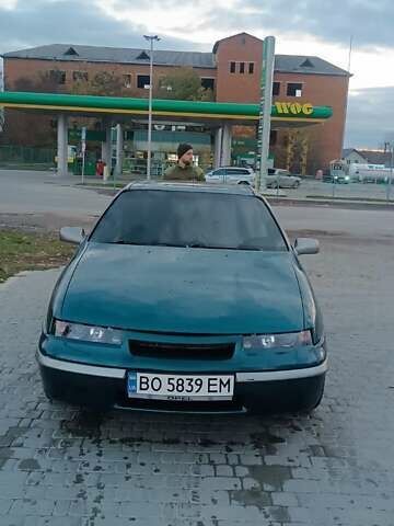 Зеленый Опель Калибра, объемом двигателя 2 л и пробегом 365 тыс. км за 2200 $, фото 1 на Automoto.ua