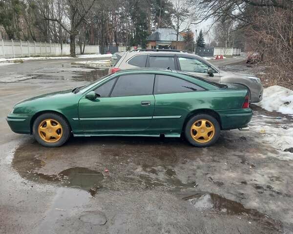 Зеленый Опель Калибра, объемом двигателя 2 л и пробегом 350 тыс. км за 2750 $, фото 1 на Automoto.ua