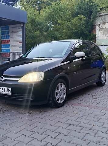 Черный Опель Корса, объемом двигателя 0.97 л и пробегом 153 тыс. км за 2400 $, фото 1 на Automoto.ua