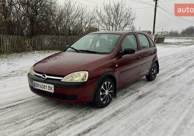 Красный Опель Корса, объемом двигателя 0.97 л и пробегом 216 тыс. км за 3050 $, фото 1 на Automoto.ua