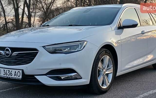 Білий Опель Інсігнія, об'ємом двигуна 1.6 л та пробігом 168 тис. км за 15100 $, фото 1 на Automoto.ua